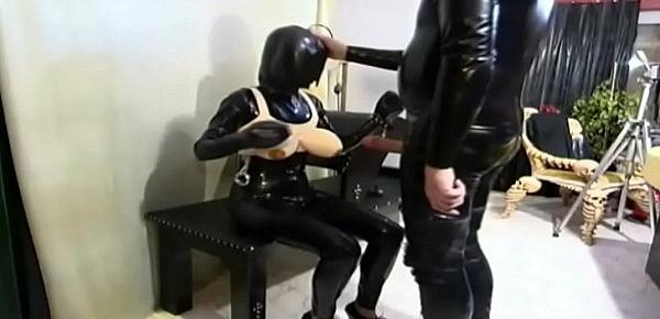  Woman in latex tied up and forced to suck a cock